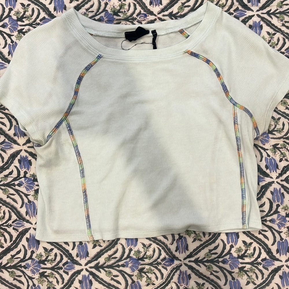 Out from under cropped tee with rainbow stitching